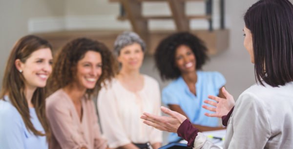 Hospice employees watching an educational presentation about the body donation process